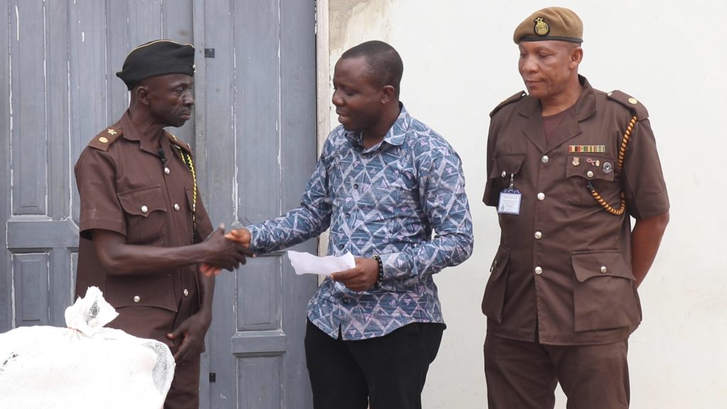 ATSU DONATES TO PRISONS. 
EXECUTIVE DIRECTOR OF CCF IN HANDSHAKE WITH DDP WILLIAMS ANAMAN.